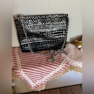 The Sak Iris Crossbody clutch with unbranded chain